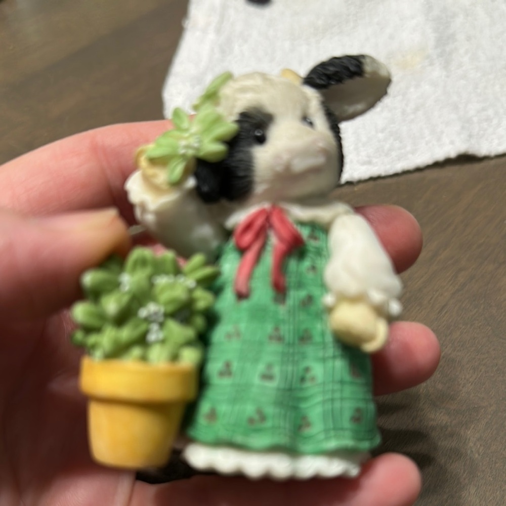 Charming Cow Figurine with Green Dress and Yellow Pot